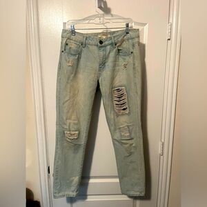 Light washed denim jeans with patched rips